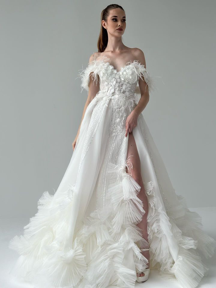 Feather-trimmed couture bridal gown by Atelier Areno