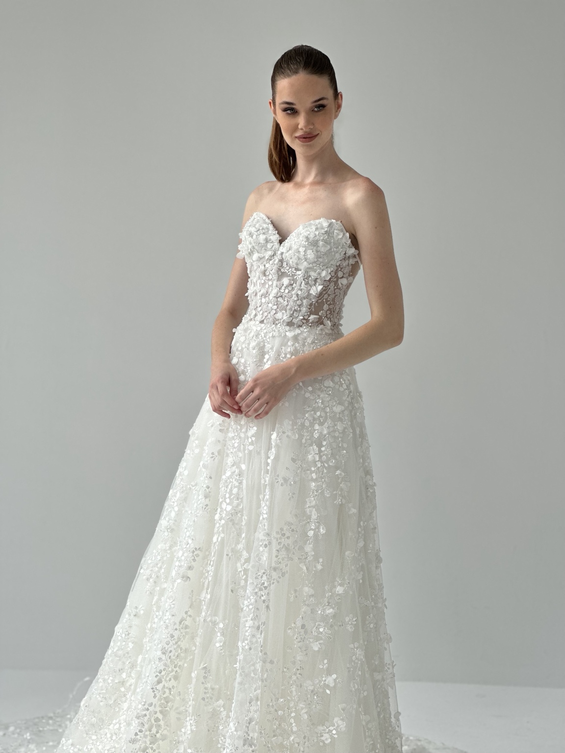 Floral appliqué bridal gown by Atelier Areno