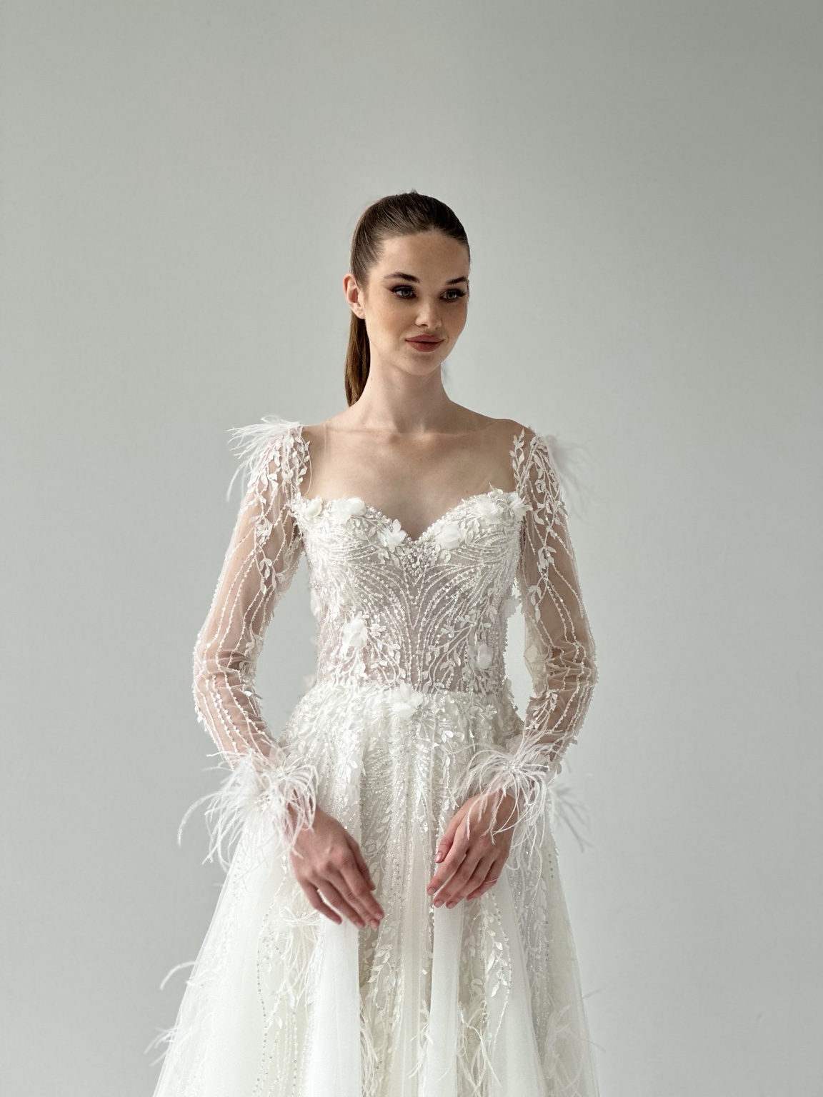 Embroidered long-sleeve bridal gown by Atelier Areno